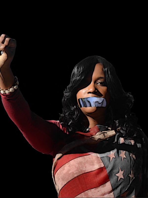 Forced Silence Condones Police Violence - Image of a black woman wrapped in american flag with a raised