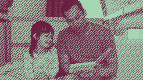 Parent and child reading a book