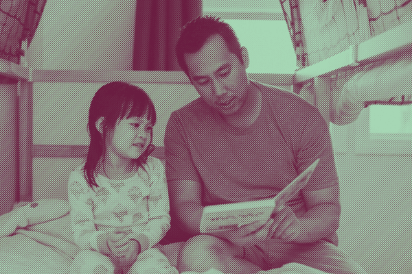Parent and child reading a book