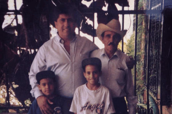 Sergio Espana with brother, uncle, and grandfather in Guatemala