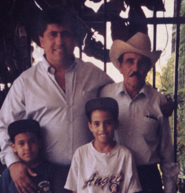 Sergio Espana with brother, uncle, and grandfather in Guatemala