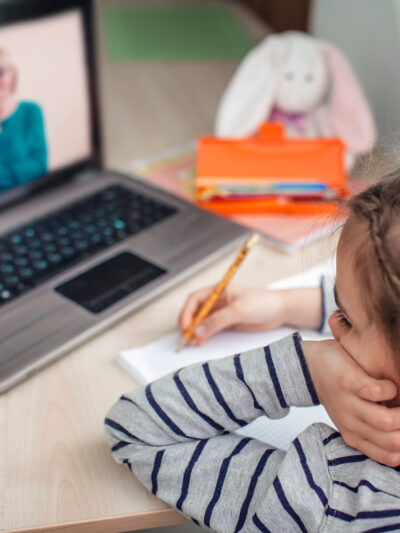 young girl working on a laptop