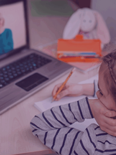 Child distance learning in front of a laptop.