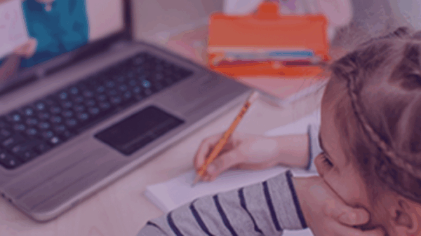 Child distance learning in front of a laptop.