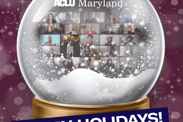 Image shows a snow gloge with ACLU of Maryland staff shown in a grid in a Zoom meeting. The bottom says Happy Holidays on a navy blue background slightly angled. The background of the image is a dark fuschia with sparkles.