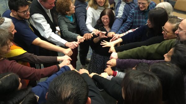 Howard County Coalition for Immigrant Justice end meeting with a group circle.