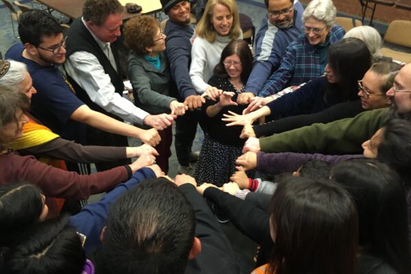 Howard County Coalition for Immigrant Justice end meeting with a group circle.