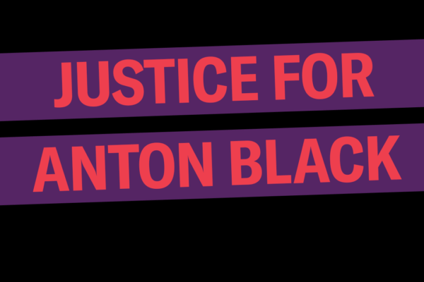 Justice for Anton Black. The background is black, the words are red in a purple rectangle that is slightly tilted up.