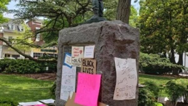 Talbot County Confederate statue is in the center and the base is surrounded by protest signs.
