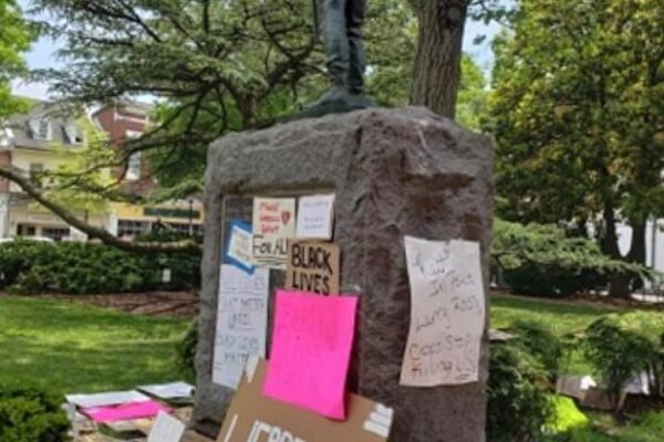 Talbot County Confederate statue is in the center and the base is surrounded by protest signs.