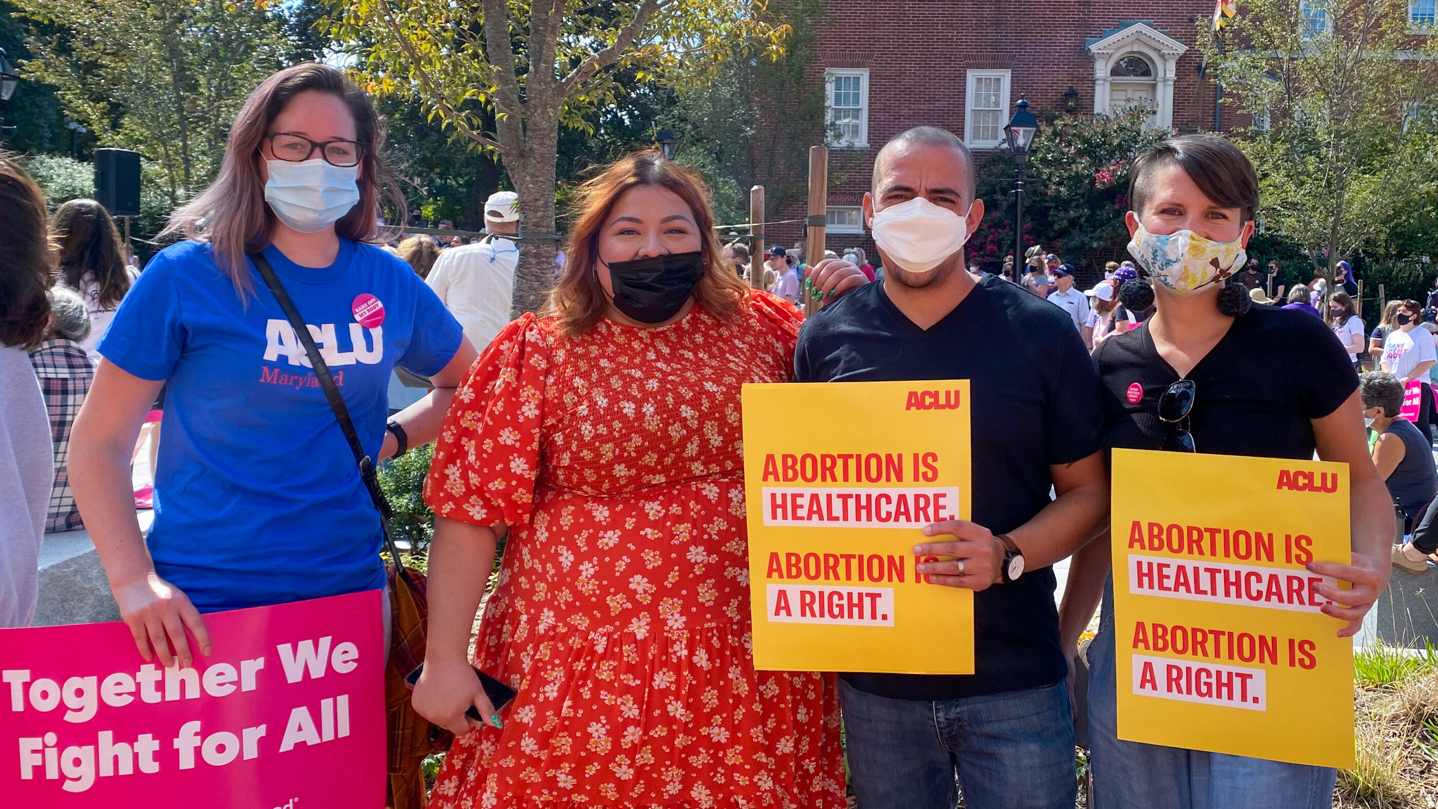 Ellen Hutton, Lorena Diaz, Sergio España, and Amy Cruice hold abortion rights protest signs at a rally in Annapolis to defend abortion.