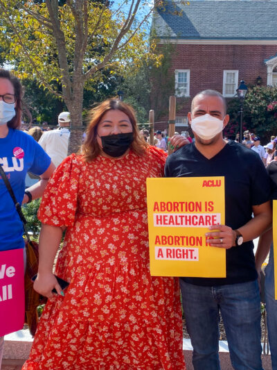 Ellen Hutton, Lorena Diaz, Sergio España, and Amy Cruice hold abortion rights protest signs at a rally in Annapolis to defend abortion.