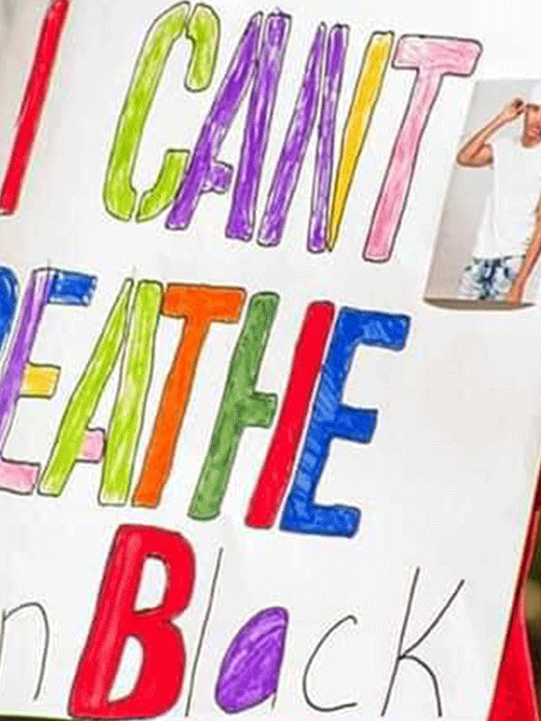 Hand-drawn protest sign says, "I can't breath. Anton Black."
