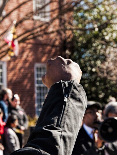 Black person's raised fist at a protest in Maryland.