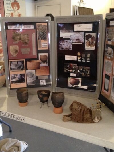 Display of history, photos, and pieces of pottery from a class the Cedarville Band of the Pisctaway Indians offered at their cultural center.