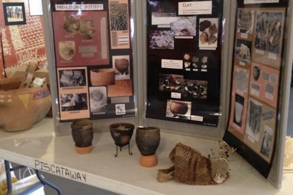 Display of history, photos, and pieces of pottery from a class the Cedarville Band of the Pisctaway Indians offered at their cultural center.
