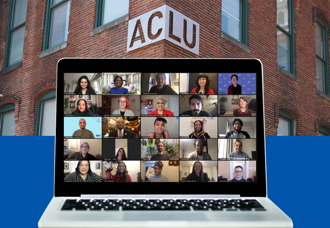 ACLU of Maryland 2020 group staff photo on Zoom shown on a laptop. The background is the ACLU-MD brick building with sign.