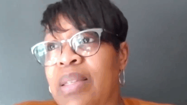 Josette Blocker is a Black woman with short hair swooped to the side. She is wearing cat-eye glasses and is looking toward the upper left of the screen.