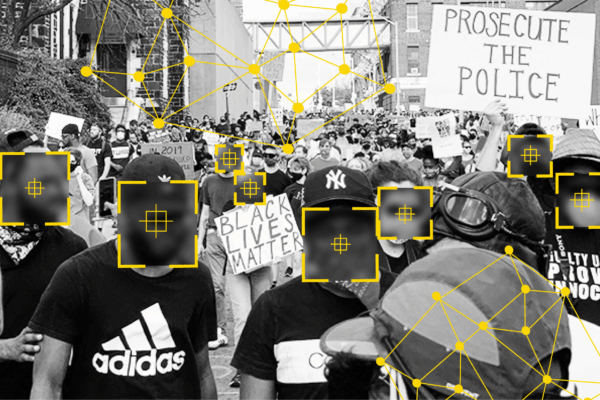 Black and white photo of people at a protest. There are overlays over people's faces that signify facial recognition technology identifying people.