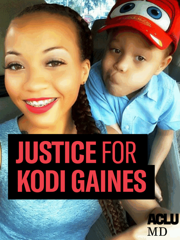 Justice for Kodi Gaines. Korryn Gaines, a Black woman with her hair in a braid, smiling, and wearing red lipstick, and her son Kodi, who is wearing a red hat and blue shirt, are taking a selfie and looking at the camera.