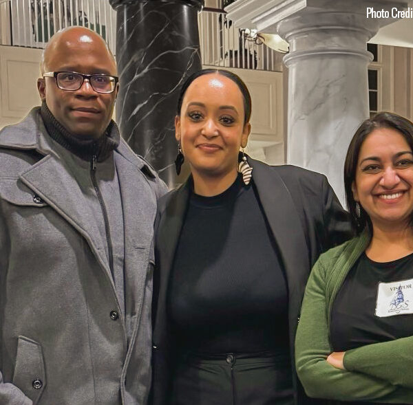 Anthony Muhammad, Yanet Amanuel, and Sonia Kumar stand together in the Maryland chamber houses on the day of a hearing in the House Judiciary Committee for the Maryland Second Look Act.
