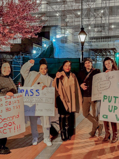 A group of Maryland advocates and Senator Carter are in Laywer's Mall holding signs in support of the Maryland Second Look Act.d