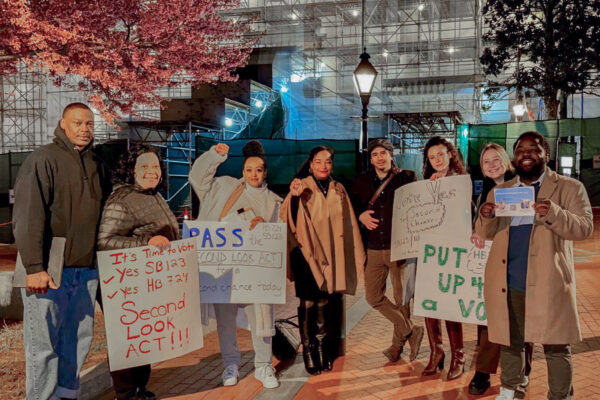 A group of Maryland advocates and Senator Carter are in Laywer's Mall holding signs in support of the Maryland Second Look Act.d