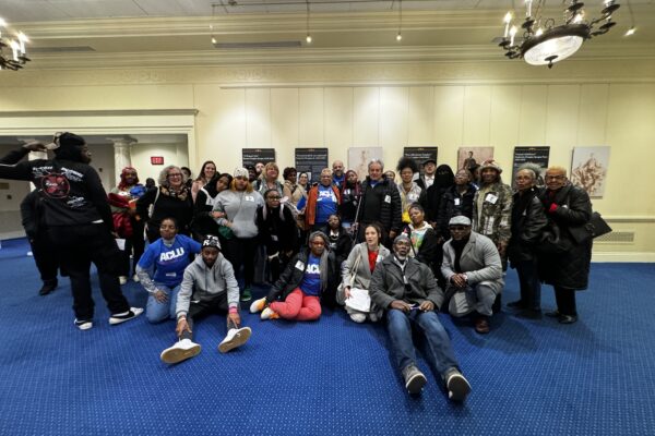 Group of advocates and directly impacted Marylanders take a group photo at in the legislative office building in Annapolis.