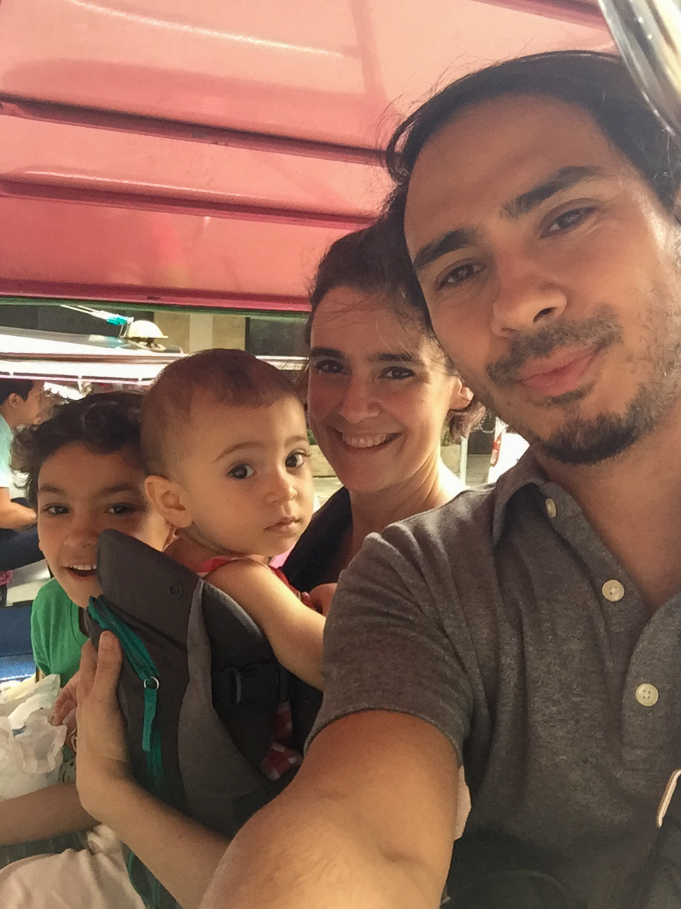 Frank, his wife, and his two children in Thailand.