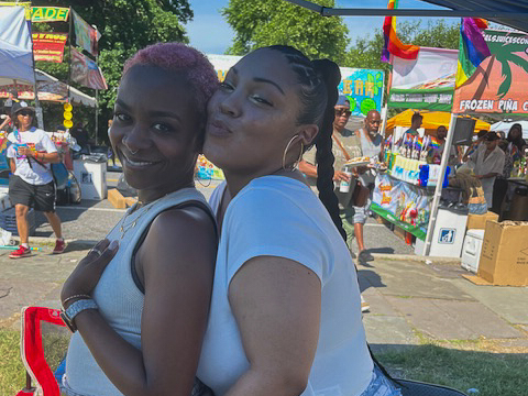 Gina Elleby and Shaque Ingram standing together at Baltimore Pride in the Park.
