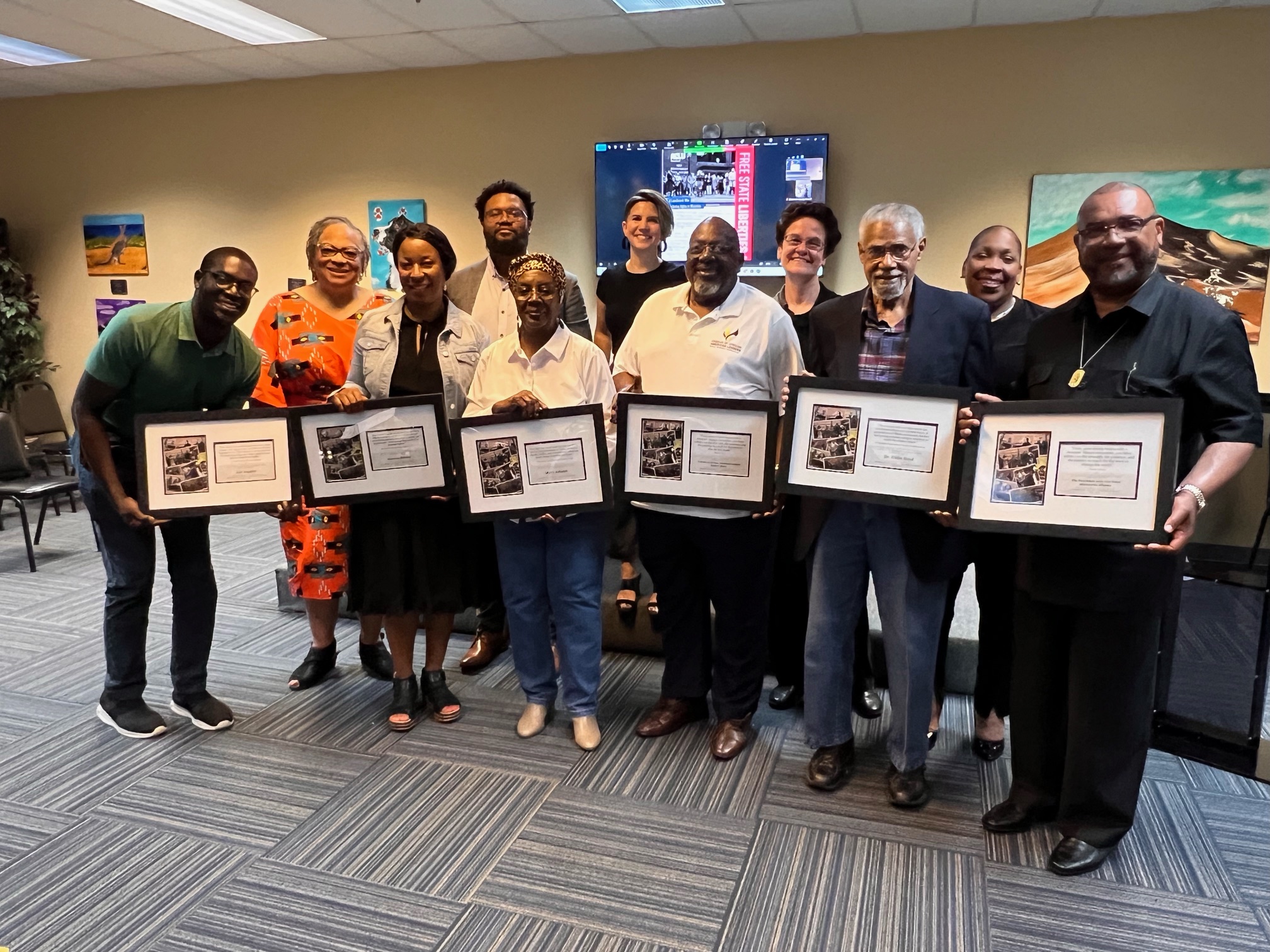 ACLU staff with residents at NAACP meeting for Wicomico voter settlement