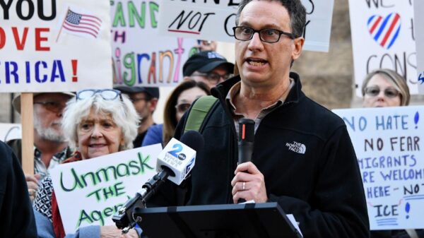 David giving a speech in front of community members at Towson Courthouse