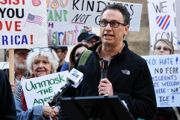 David giving a speech in front of community members at Towson Courthouse