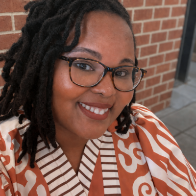 Ieshaah in dark rimmed glasses