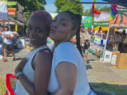 Gina Elleby and Shaque Ingram standing together at Baltimore Pride in the Park.