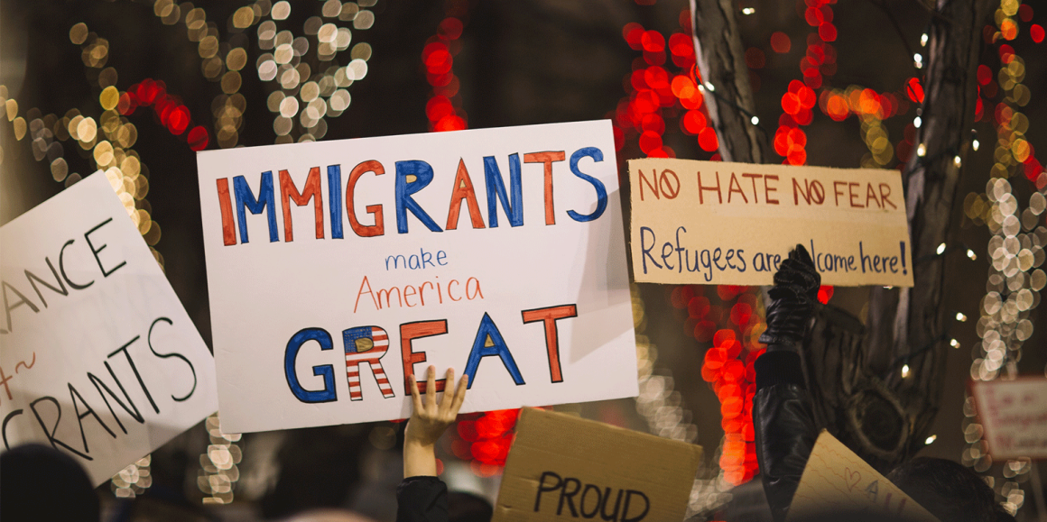 "Immigrants Make America Great" protest sign