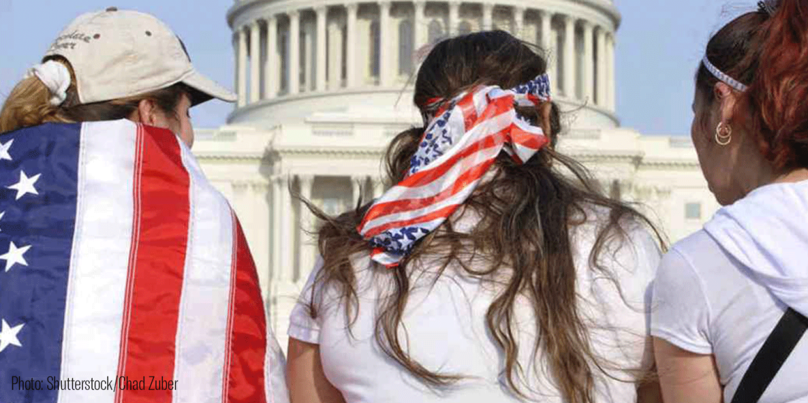 3 Latinx people with American flags