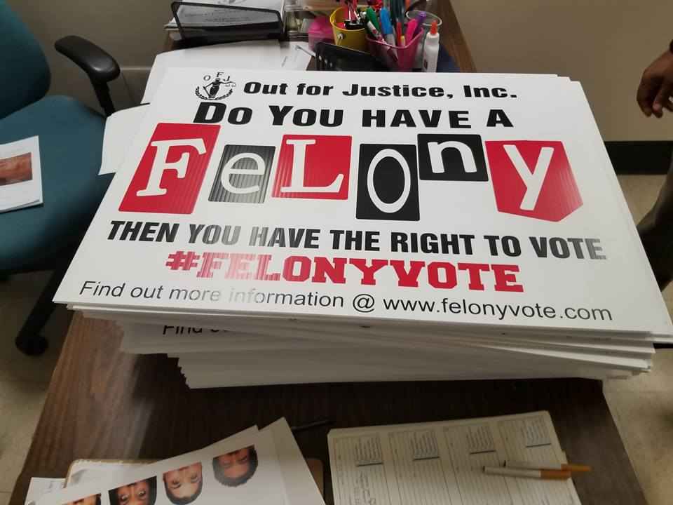 A protest sign from Out for Justice, Inc. that says" Do you have a felony? Then you have the right to vote."