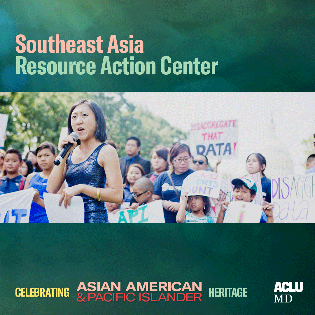 Celebrating Asian American Pacific Islander Heritage. Southeast Asia Resource Action Center. Group rally protest photo in Washington, DC. A person is holidng a mic and many others are holidng signs.