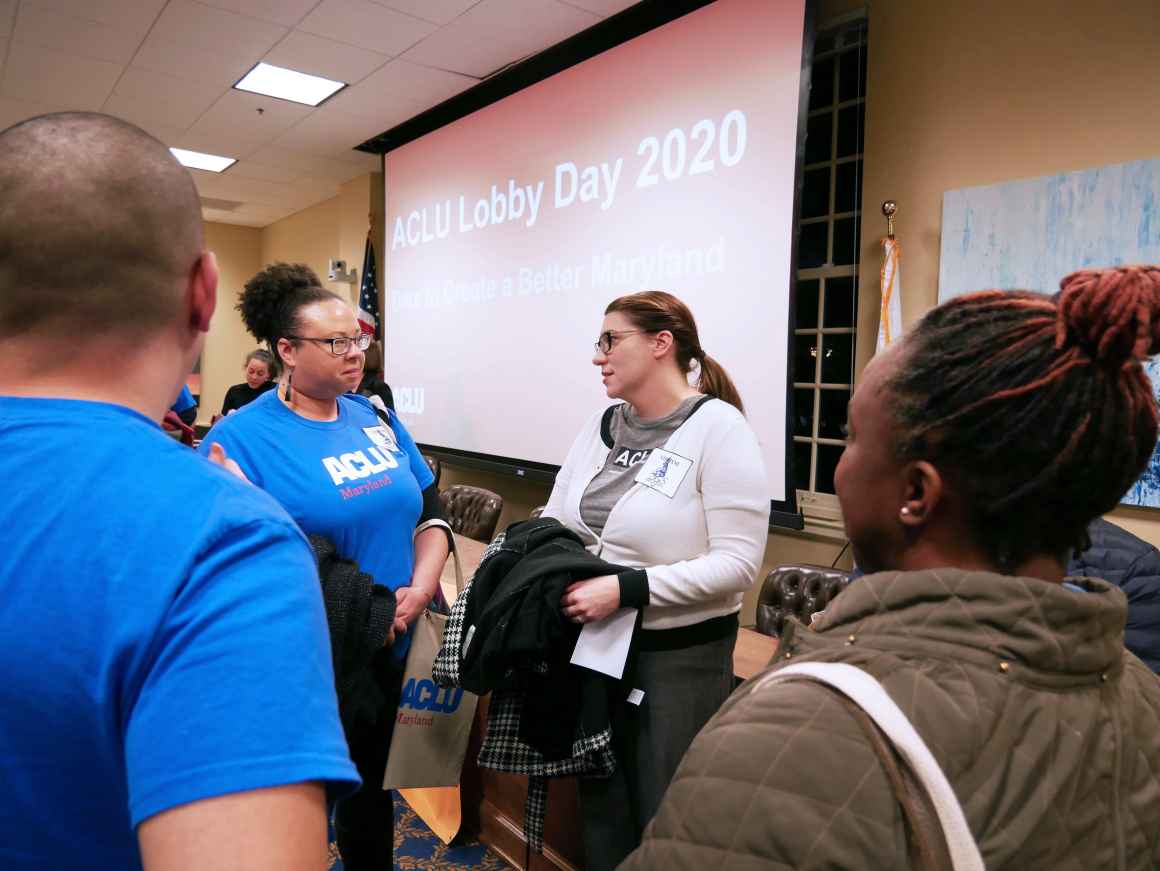 ACLU of Maryland members are standing together at the Lobby Day 2020 event in Annapolis wearing blue ACLU t-shirts.