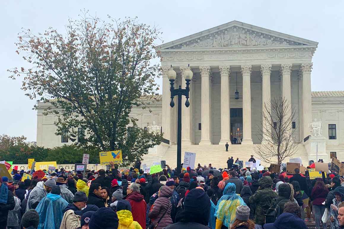 Supporters of DACA gather in the rain in front of the Supreme Court building in Washington, DC for the "Home is Here" rally.
