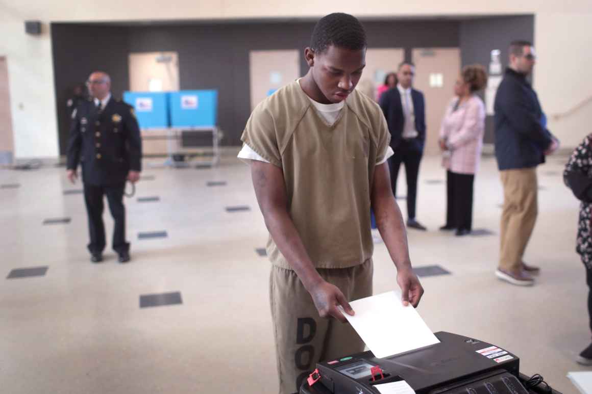 A Black person who is currently incarcerated is in the process of voting.