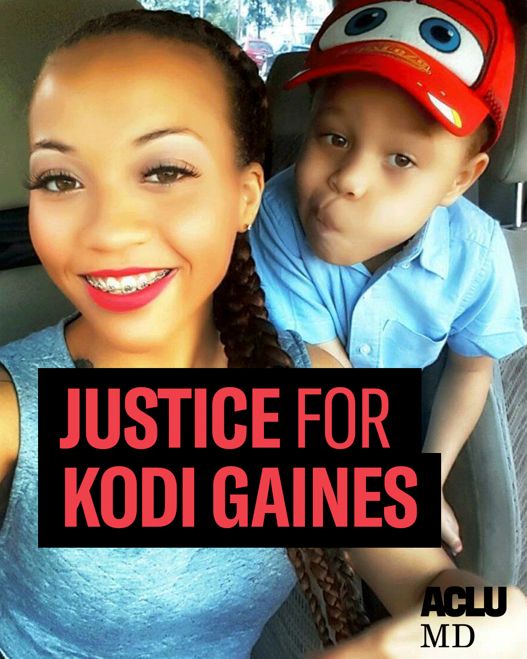 Justice for Kodi Gaines. Korryn Gaines, a Black woman with her hair in a braid, smiling, and wearing red lipstick, and her son Kodi, who is wearing a red hat and blue shirt, are taking a selfie and looking at the camera.