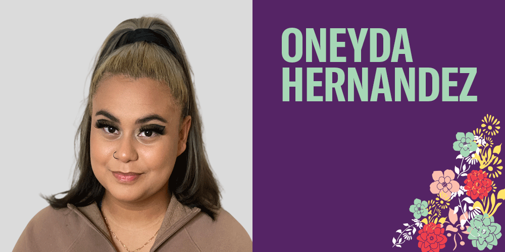 Oneya Hernandez has hair that is a blend of blond and dark brown and the top section is pulled up. She has dramatic eyelashes and has a slight smile on her face. She has a latte creamy skin tone. There are bright colorful flowers on the bottom right.