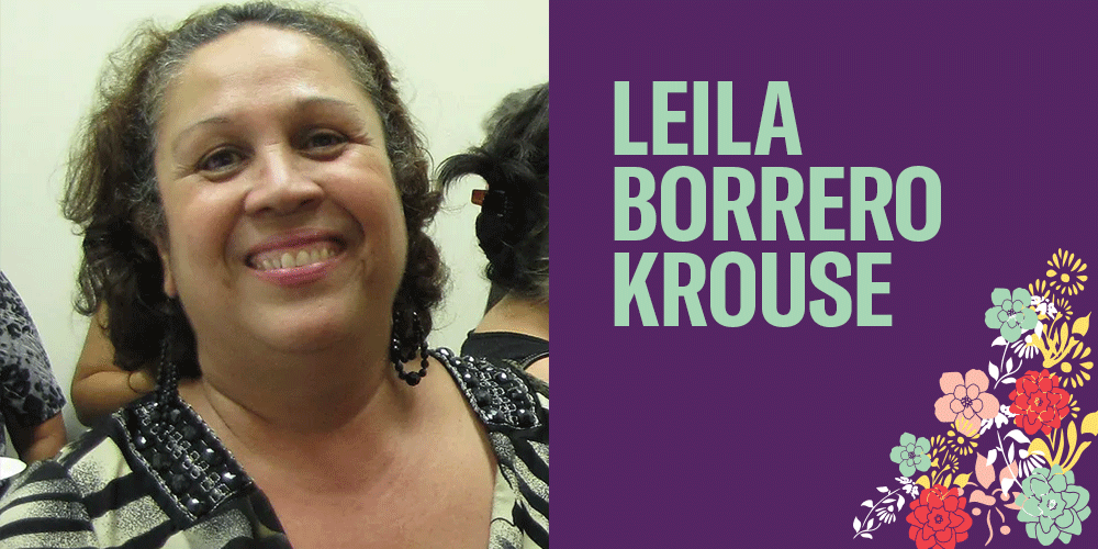 Leila Borrero Krouse is a woman with hair just above her shoulders. She has a light brown skin tone and is smiling. There are bright flower images in the bottom right corner.