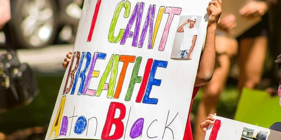 Hand-drawn protest sign says, "I can't breath. Anton Black."
