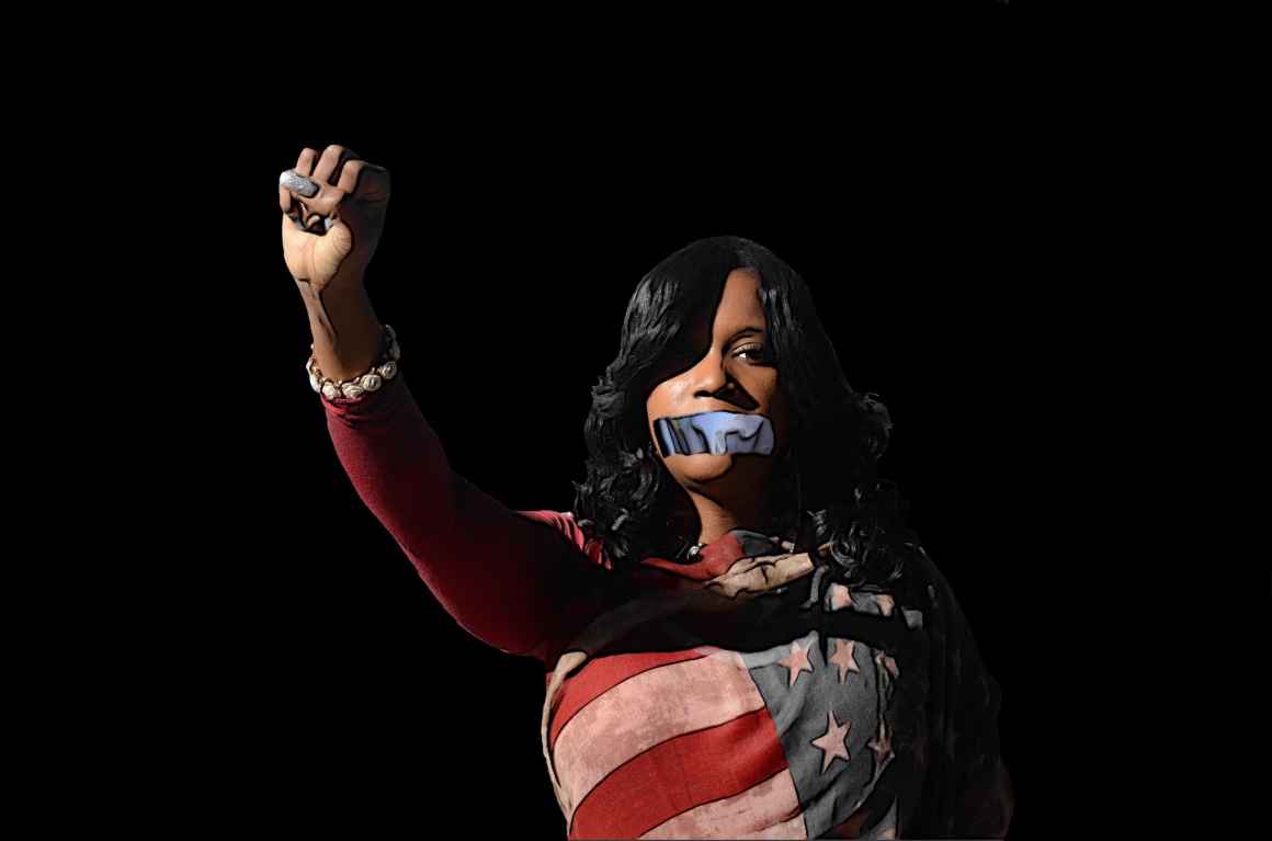 Forced Silence Condones Police Violence - Image of a black woman wrapped in american flag with a raised