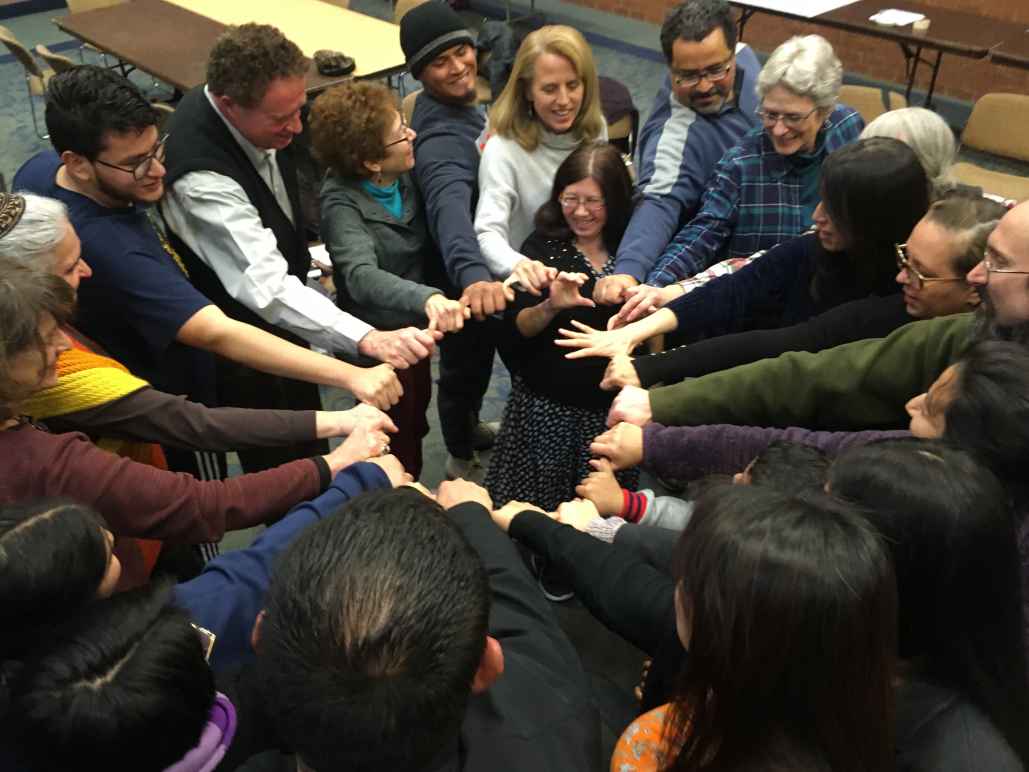 Howard County Coalition for Immigrant Justice end meeting with a group circle.