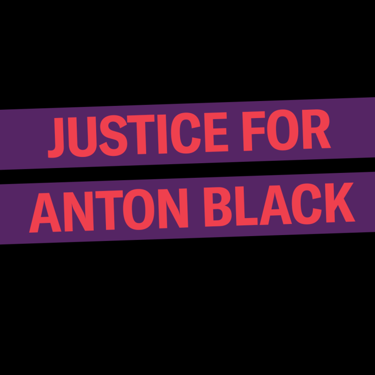 Justice for Anton Black. The background is black, the words are red in a purple rectangle that is slightly tilted up.