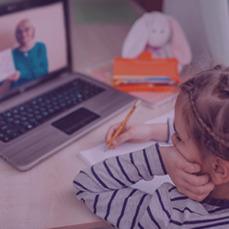 Child distance learning in front of a laptop.